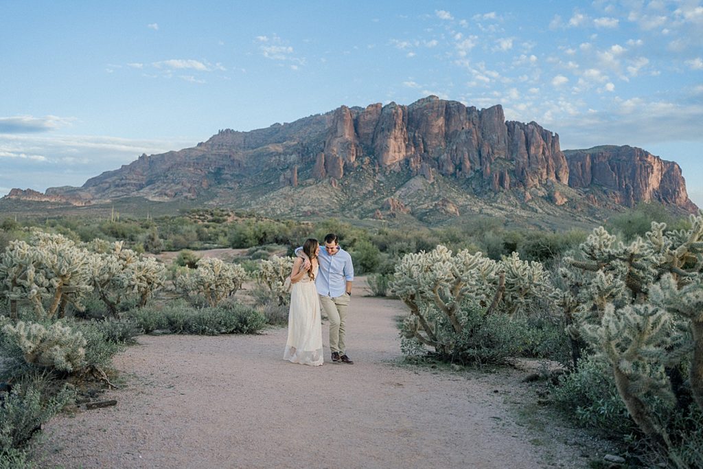 Destination engagement with the superstition mountains in the background with blue skies