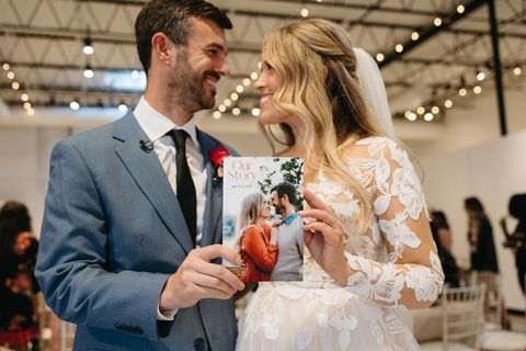 newlyweds with their love story wedding storybook program